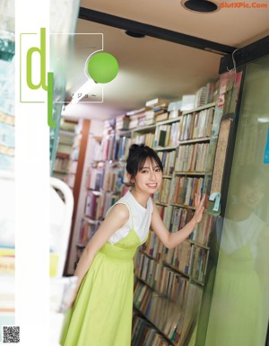 a magazine page with a picture of a woman in a white dress