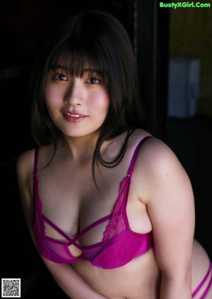 A woman in a bikini posing for the camera.